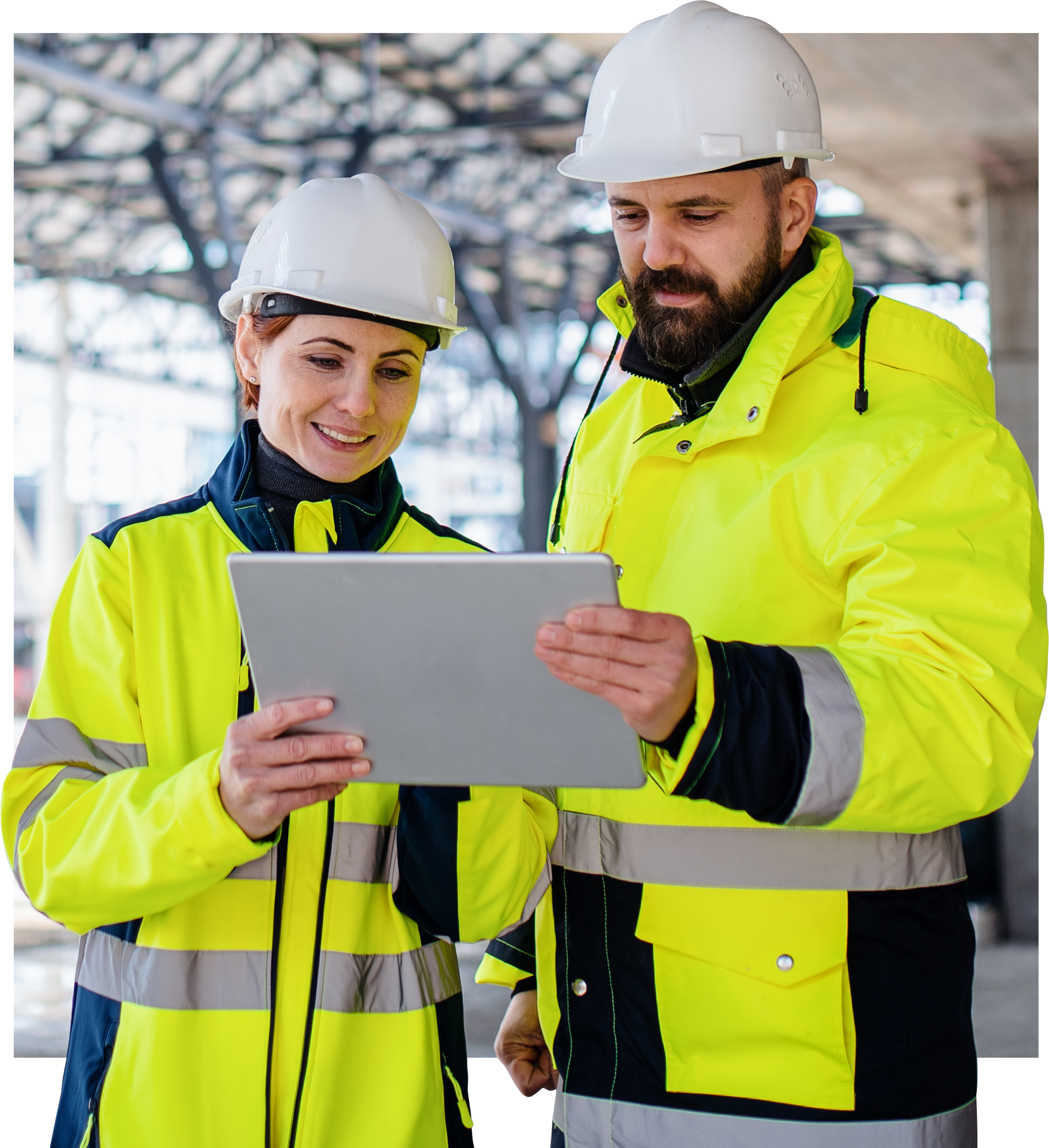 Project manager reviewing building plans on-site